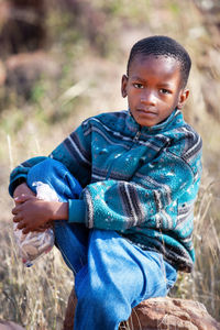 Portrait of boy standing outdoors