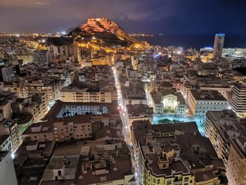 High angle view of illuminated buildings in city