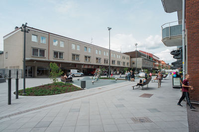 People walking on street in city