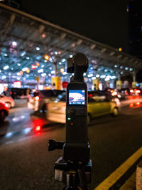 Filming with a small gimbal camera with built in stabilizer at night on the road.