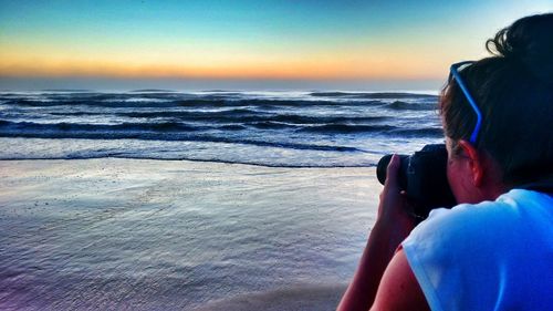 Scenic view of sea at sunset