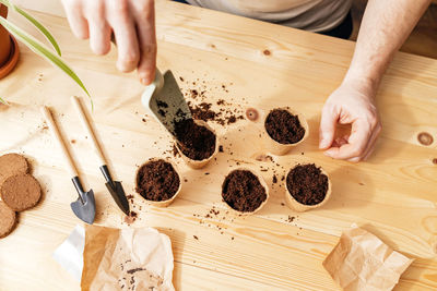 Midsection of woman preparing food on table