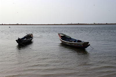 Boat on sea against clear sky