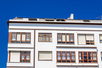 Low angle view of building against blue sky