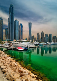 View of boats moored in city