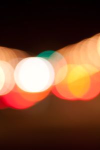 Close-up of illuminated lights against sky during sunset