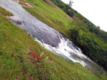 Scenic view of waterfall against clear sky