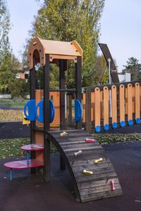 Empty playground against blue sky in park