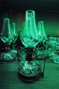 Close-up of wine glasses on table