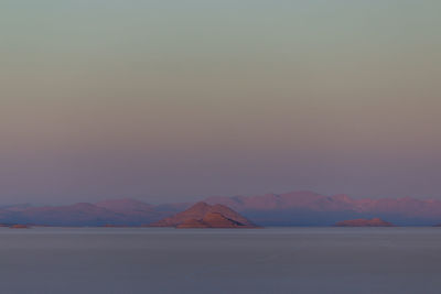 Scenic view of mountains against sky during sunset