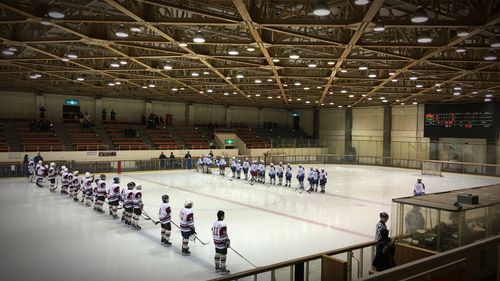 High angle view of ice hockey players standing in rows