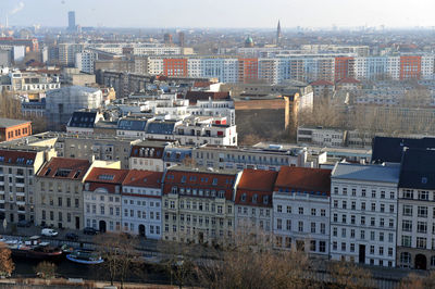 High angle view of buildings in town against sky