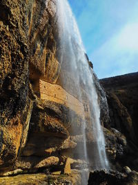 Low angle view of waterfall