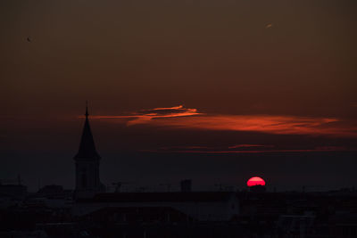 Cityscape against sky during sunset