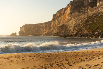 Scenic view of beach against clear sky