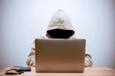 Man using laptop on table