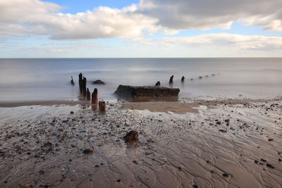 Scenic view of beach against sky