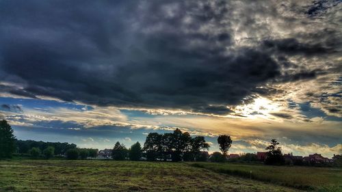 Scenic view of dramatic sky over land