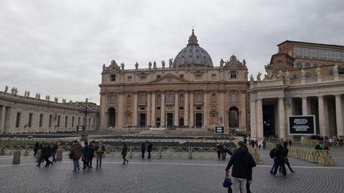 Tourists in front of building