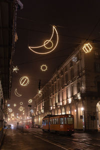 Illuminated city street at night