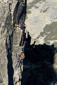 People climbing on rock