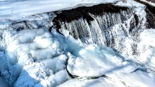 Scenic view of frozen waterfall