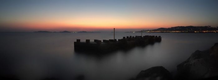 Scenic view of sea at sunset