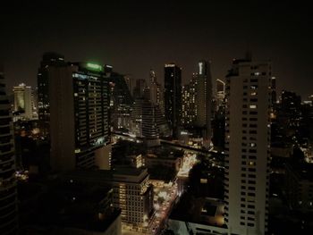 High angle view of illuminated buildings in city at night