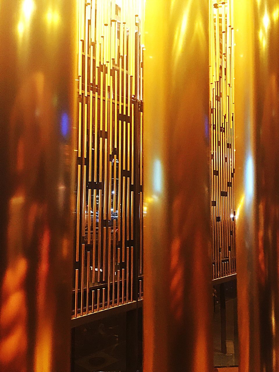 metal, architecture, built structure, sunset, orange color, illuminated, safety, protection, fence, metallic, metal grate, sunlight, railing, security, pattern, no people, building exterior, yellow, indoors