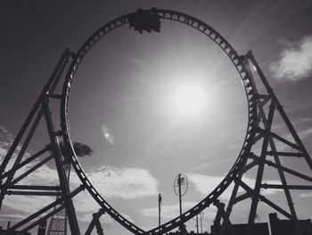 Low angle view of ferris wheel against sky