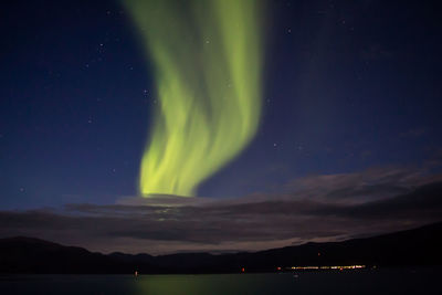 Scenic view of landscape against sky at night
