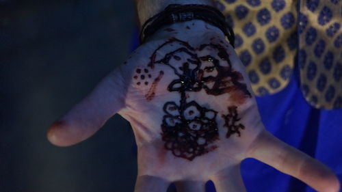 Close-up of woman hand with tattoo