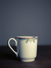 Close-up of broken coffee cup on table