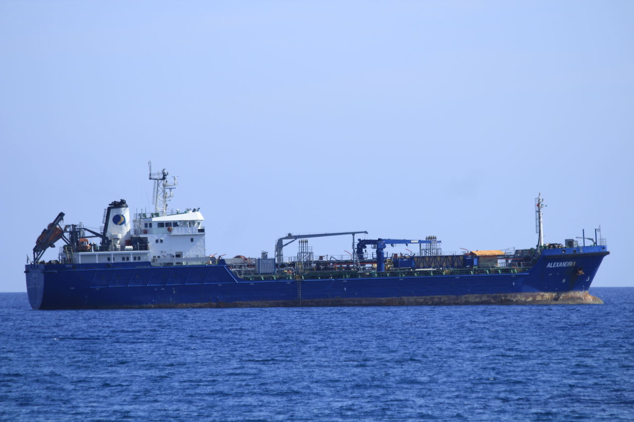 copy space, sea, transportation, nautical vessel, clear sky, water, outdoors, waterfront, mode of transport, sky, nature, no people, day, offshore platform, drilling rig