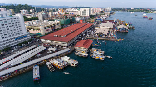 High angle view of cityscape by sea