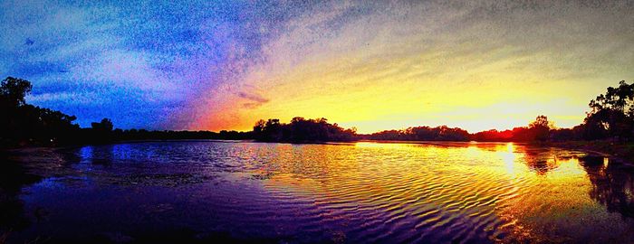 Scenic view of lake at sunset