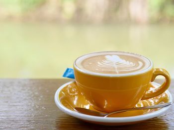 Close-up of cappuccino on table
