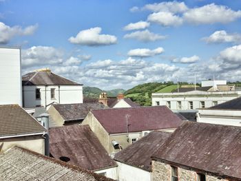 High angle view of houses against cloudy sky