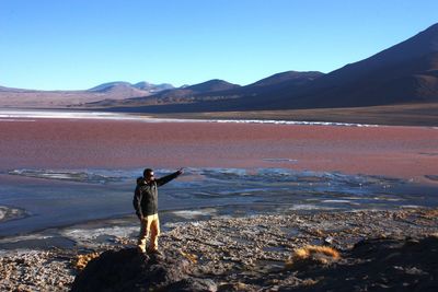 Man standing by salt lake