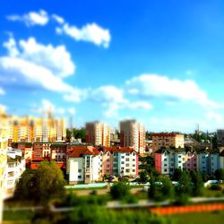 Buildings against cloudy sky