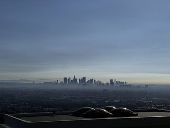 Cityscape against sky during sunset