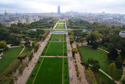 High angle view of trees and buildings in city