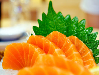 Close-up of orange fruit in plate