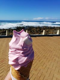 Close-up of ice cream on beach