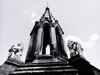 Low angle view of statue against sky