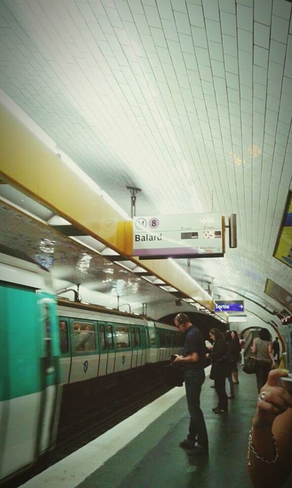 BLURRED MOTION OF SUBWAY TRAIN AT STATION