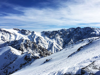 Scenic view of snowcapped mountains against sky