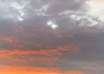 Low angle view of dramatic sky during sunset