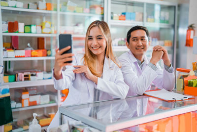 Portrait of female friends in laboratory