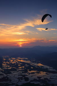 Paddy fields, sunsets and paragliders